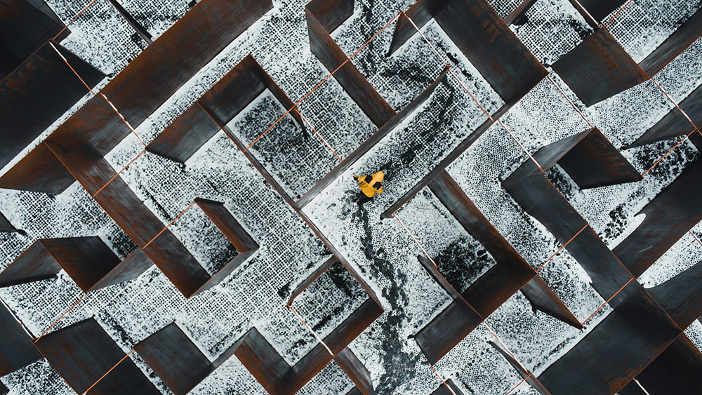 Person finding the way through maze - illustrative